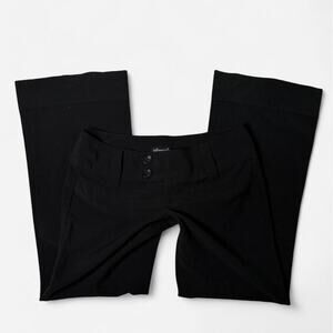 Spacegirlz black flare pants with button detail in size 9.